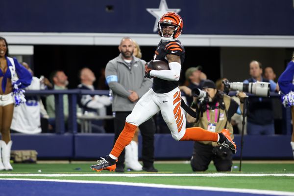 Dec 9, 2024; Arlington, Texas, USA; Cincinnati Bengals wide receiver Ja'Marr Chase (1) scores a touchdown against the Dallas Cowboys in the fourth quarter at AT&T Stadium. Mandatory Credit: Tim Heitman-Imagn Images