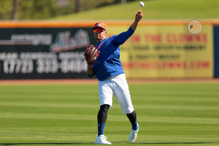 Feb 17, 2025; Port St. Lucie, FL, USA; New York Mets right fielder Juan Soto (22) plays catch during a spring training workout at Clover Park. Credit: Sam Navarro-Imagn Images