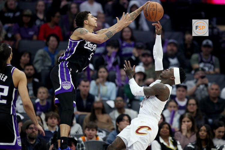 Feb 7, 2026; Sacramento, California, USA; Sacramento Kings guard Nique Clifford (5) blocks the shot from Cleveland Cavaliers guard Dennis Schroder (8) during the first quarter at Golden 1 Center. Credit: Dennis Lee-Imagn Images