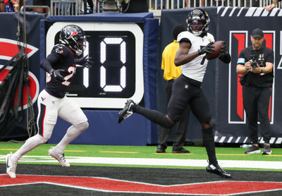 Sep 29, 2024; Houston, Texas, USA;  Jacksonville Jaguars wide receiver Brian Thomas Jr. (7) catches a touchdown against Houston Texans safety Eric Murray (23) in the first quarterat NRG Stadium. Mandatory Credit: Thomas Shea-Imagn Images