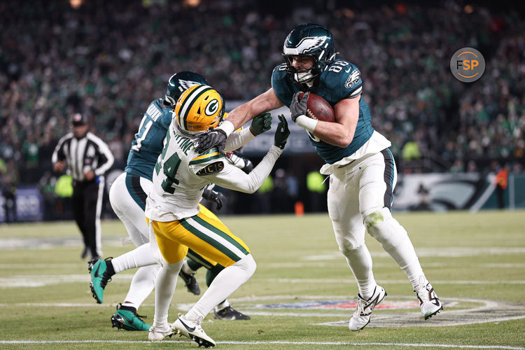 Jan 12, 2025; Philadelphia, Pennsylvania, USA; Philadelphia Eagles tight end Dallas Goedert (88) runs with the ball against Green Bay Packers cornerback Carrington Valentine (24) after a catch in an NFC wild card game at Lincoln Financial Field. Credit: Bill Streicher-Imagn Images