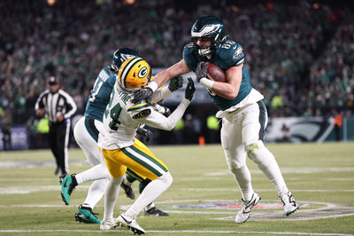 Jan 12, 2025; Philadelphia, Pennsylvania, USA; Philadelphia Eagles tight end Dallas Goedert (88) runs with the ball against Green Bay Packers cornerback Carrington Valentine (24) after a catch in an NFC wild card game at Lincoln Financial Field. Mandatory Credit: Bill Streicher-Imagn Images