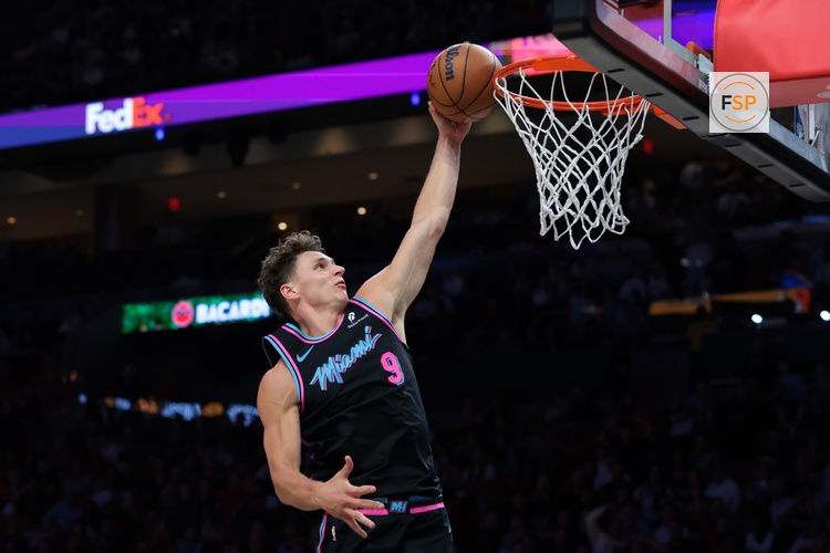 Dec 27, 2025; Miami, Florida, USA; Miami Heat guard Pelle Larsson (9) dunks against the Indiana Pacers during the second half at Kaseya Center. Credit: Sam Navarro-Imagn Images