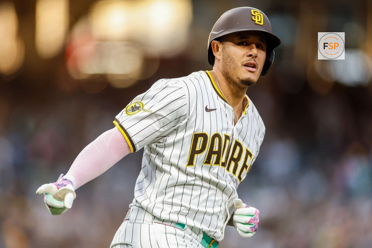 Sep 13, 2025; San Diego, California, USA; San Diego Padres third baseman Manny Machado (13) hits a one run home run during the third inning against the Colorado Rockies at Petco Park. Credit: David Frerker-Imagn Images