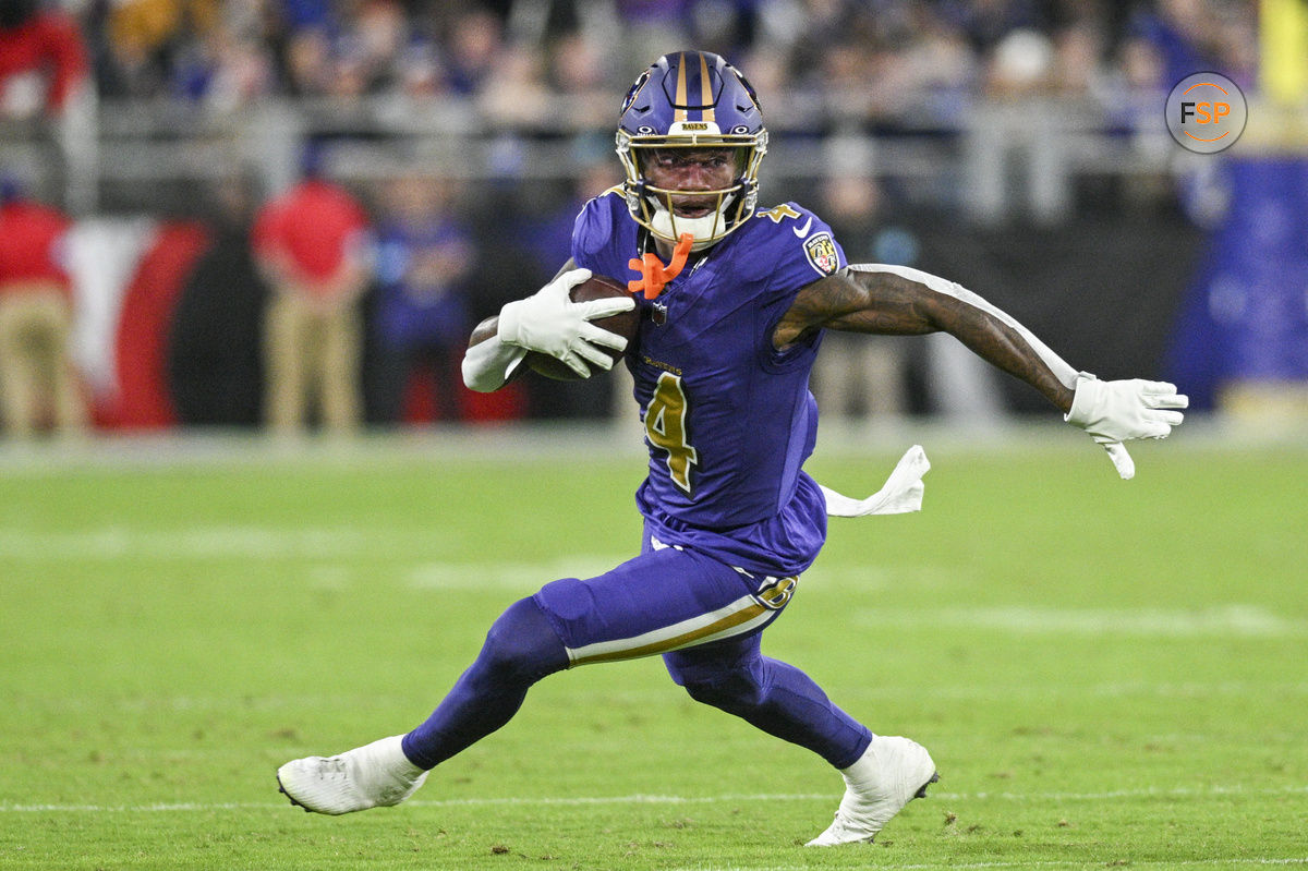 Nov 7, 2024; Baltimore, Maryland, USA; Baltimore Ravens wide receiver Zay Flowers (4) runs after a second quarter catch against the Cincinnati Bengals at M&T Bank Stadium. Credit: Tommy Gilligan-Imagn Images