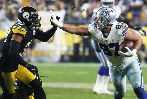 Oct 6, 2024; Pittsburgh, Pennsylvania, USA;  Dallas Cowboys tight end Jake Ferguson (87) runs after a catch against the Pittsburgh Steelers Minkah Fitzpatrick (39) during the fourth quarter at Acrisure Stadium. Mandatory Credit: Charles LeClaire-Imagn Images