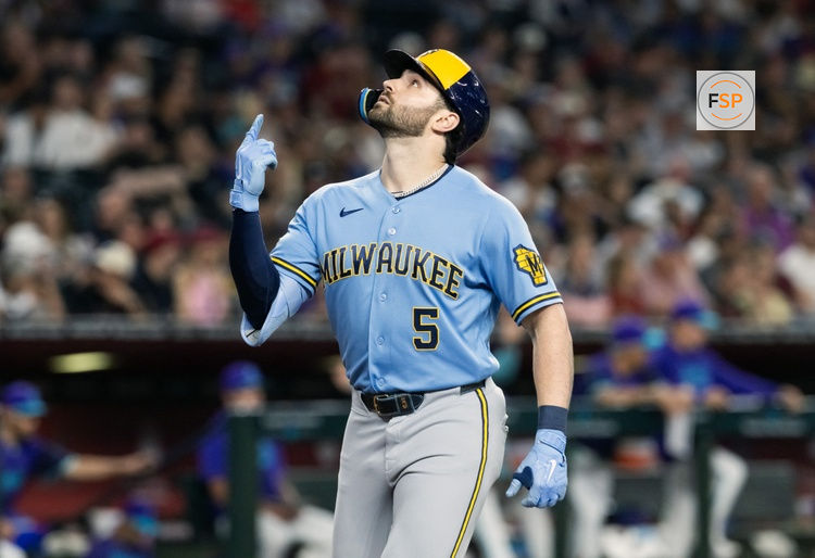 Jul 3, 2026; Phoenix, Arizona, USA; Milwaukee Brewers outfielder Garrett Mitchell celebrates as he rounds the bases after hitting a two run home run in the second inning against the Arizona Diamondbacks at Chase Field. Credit: Mark J. Rebilas-Imagn Images