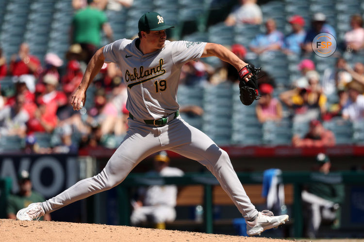 Jun 26, 2024; Anaheim, California, USA;  Oakland Athletics relief pitcher Mason Miller (19) pitches during the eighth inning against the Los Angeles Angels at Angel Stadium. Credit: Kiyoshi Mio-USA TODAY Sports