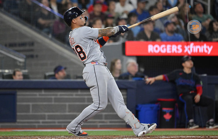May 16, 2025; Toronto, Ontario, CAN;  Detroit Tigers center fielder Javier Baez (28) hits a solo home run against the Toronto Blue Jays in the eighth inning at Rogers Centre. Credit: Dan Hamilton-Imagn Images
