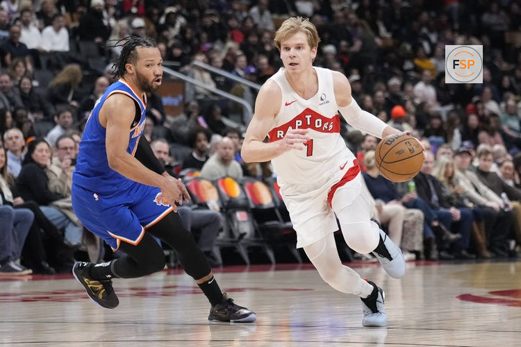 Feb 4, 2025; Toronto, Ontario, CAN; Toronto Raptors guard Gradey Dick (1) drives to the net past New York Knicks guard Jalen Brunson (11) during the second half at Scotiabank Arena. Credit: John E. Sokolowski-Imagn Images