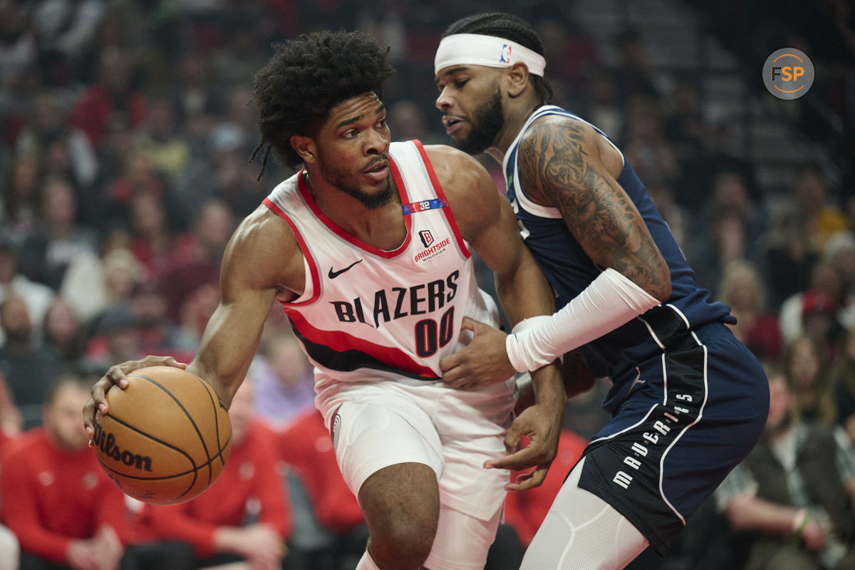 Dec 28, 2024; Portland, Oregon, USA; Portland Trail Blazers guard Scoot Henderson (00) passes the ball during the first half against Dallas Mavericks guard Jaden Hardy (1) at Moda Center. Credit: Troy Wayrynen-Imagn Images