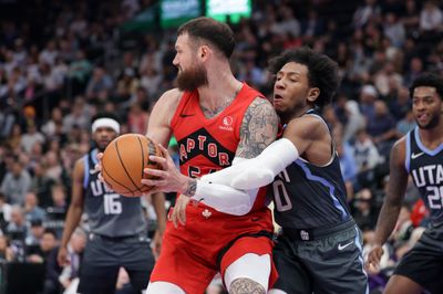 Mar 23, 2026; Salt Lake City, Utah, USA;  Utah Jazz guard Kennedy Chandler (0) reaches around Toronto Raptors forward/center Sandro Mamukelashvili (54) and tries to get to the ball during the second half at Delta Center. Mandatory Credit: Chris Nicoll-Imagn Images
