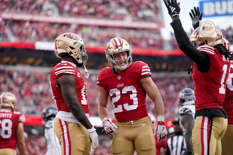 Dec 10, 2023; Santa Clara, California, USA; San Francisco 49ers running back Christian McCaffrey (23) stands next to wide receiver Deebo Samuel (19) and wide receiver Brandon Aiyuk (11) after the 49ers picked up a first down near the end zone against the Seattle Seahawks in the third quarter at Levi's Stadium. Credit: Cary Edmondson-USA TODAY Sports