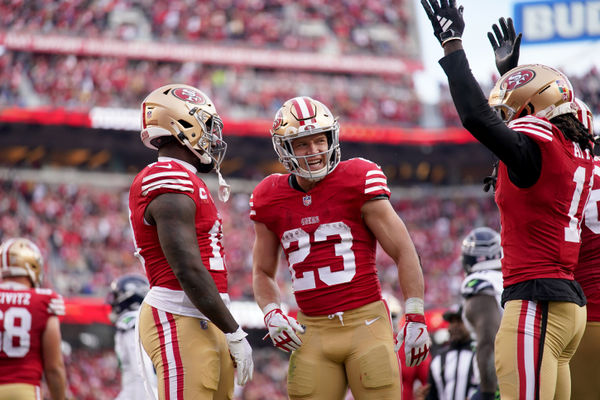 Dec 10, 2023; Santa Clara, California, USA; San Francisco 49ers running back Christian McCaffrey (23) stands next to wide receiver Deebo Samuel (19) and wide receiver Brandon Aiyuk (11) after the 49ers picked up a first down near the end zone against the Seattle Seahawks in the third quarter at Levi's Stadium. Mandatory Credit: Cary Edmondson-USA TODAY Sports