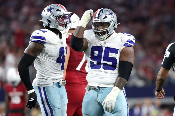 Nov 3, 2025; Arlington, Texas, USA; Dallas Cowboys defensive tackle Kenny Clark (95) and defensive end Donovan Ezeiruaku (41) celebrate after a sack Arizona Cardinals quarterback Jacoby Brissett (7) in the second half at AT&T Stadium. Mandatory Credit: Kevin Jairaj-Imagn Images