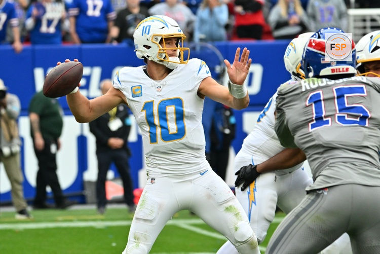 Sep 27, 2026; Orchard Park, New York, USA;  Los Angeles Chargers quarterback Justin Herbert (10) throws in the second half against the Buffalo Bills at New Highmark Stadium.  Credit: Mark Konezny-Imagn Images