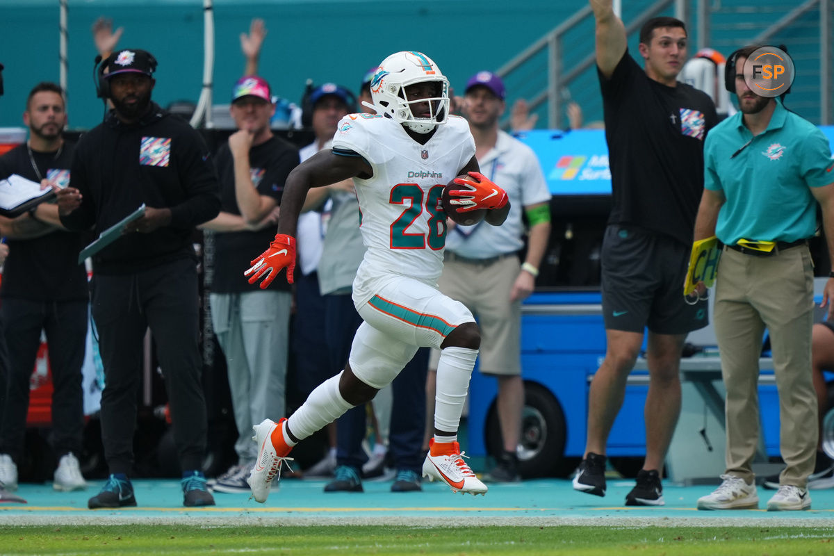 Oct 8, 2023; Miami Gardens, Florida, USA; Miami Dolphins running back De'Von Achane (28) runs with the ball against the New York Giants during the first half at Hard Rock Stadium. Credit: Jasen Vinlove-USA TODAY Sports