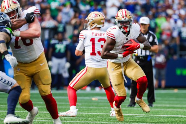 Sep 7, 2025; Seattle, Washington, USA; San Francisco 49ers running back Brian Robinson Jr. (3) rushes against the Seattle Seahawks during the fourth quarter at Lumen Field. Mandatory Credit: Joe Nicholson-Imagn Images