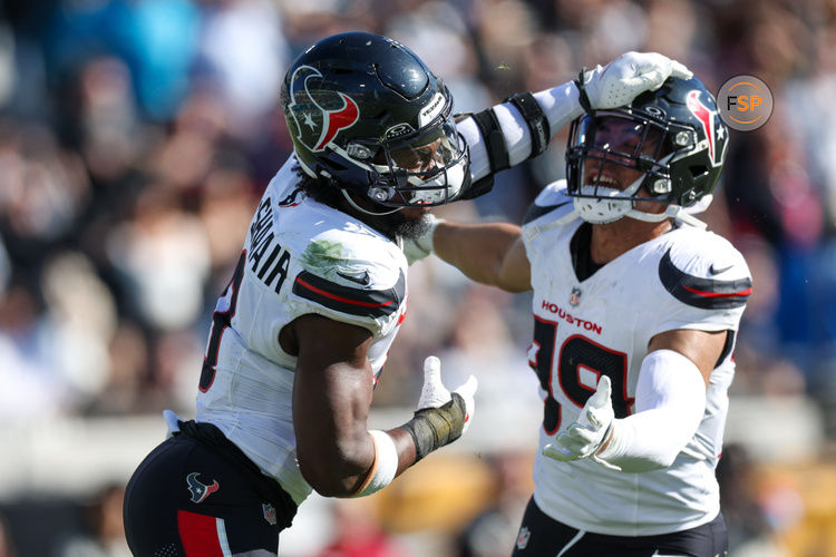 Dec 1, 2024; Jacksonville, Florida, USA;Houston Texans linebacker Azeez Al-Shaair (0) is held back by Houston Texans linebacker Henry To'oTo'o (39) after being ejected against the Jacksonville Jaguars in the second quarter  at EverBank Stadium. Credit: Nathan Ray Seebeck-Imagn Images