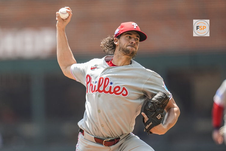 Apr 26, 2026; Cumberland, Georgia, USA; Philadelphia Phillies pitcher Aaron Nola (27) pitches against the Atlanta Braves during the first inning at Truist Park. Credit: Dale Zanine-Imagn Images