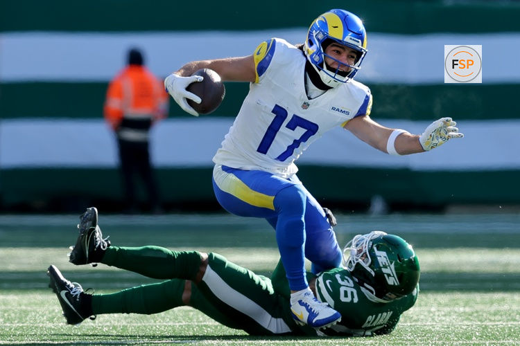 Dec 22, 2024; East Rutherford, New Jersey, USA; New York Jets safety Chuck Clark (36) tackles Los Angeles Rams wide receiver Puka Nacua (17) during the first quarter at MetLife Stadium. Credit: Brad Penner-Imagn Images
