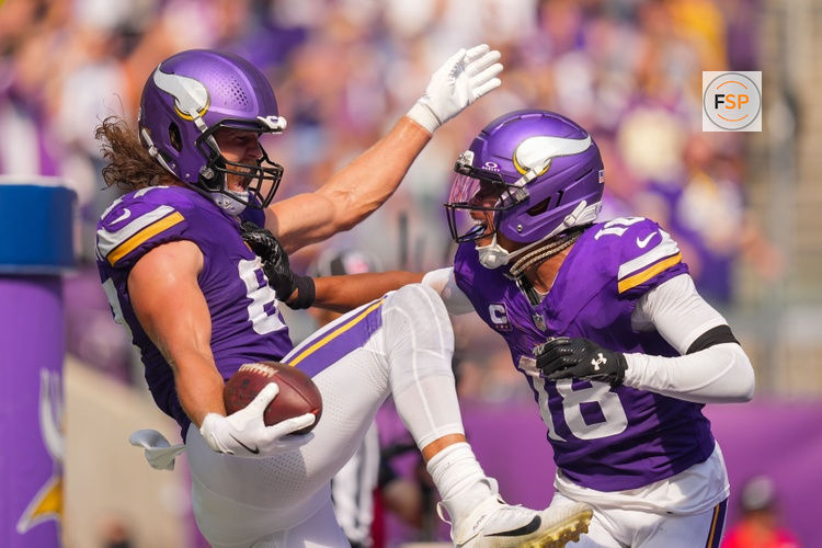 Sep 21, 2025; Minneapolis, Minnesota, USA; Minnesota Vikings tight end TJ. Hockenson (87) reacts with wide receiver Justin Jefferson (18) after catching a touchdown pass against the Cincinnati Bengals during the second half at U.S. Bank Stadium. Credit: Brad Rempel-Imagn Images