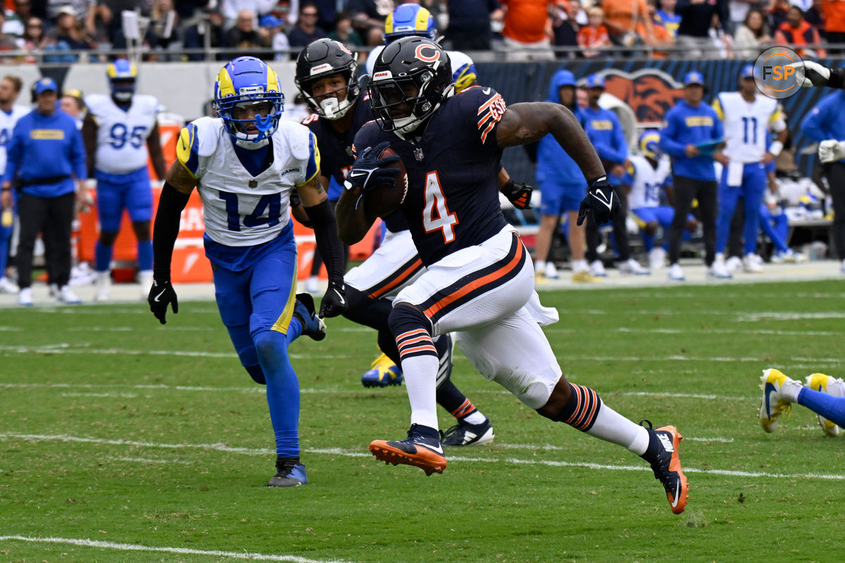 Sep 29, 2024; Chicago, Illinois, USA;  Chicago Bears running back D'Andre Swift (4) breaks through for a touchdown against the Los Angeles Rams during the second half at Soldier Field. Credit: Matt Marton-Imagn Images