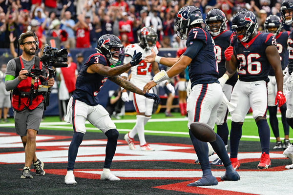 HOUSTON, TX - NOVEMBER 05: Houston Texans wide receiver Tank Dell (3) congratulates Houston Texans quarterback C.J. Stroud (7) after he scored a two-point conversion during the football game between the Tampa Bay Buccaneers and Houston Texans at NRG Stadium on November 5, 2023, in Houston, Texas. (Photo by Ken Murray/Icon Sportswire)