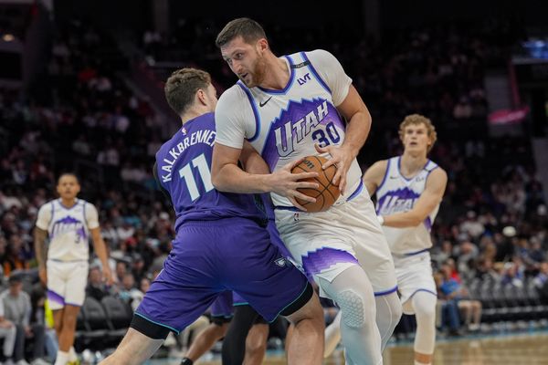 Nov 2, 2025; Charlotte, North Carolina, USA; Utah Jazz center Jusuf Nurkic (30) tries to elude Charlotte Hornets center Ryan Kalkbrenner (11) during the second half at Spectrum Center. Mandatory Credit: Jim Dedmon-Imagn Images