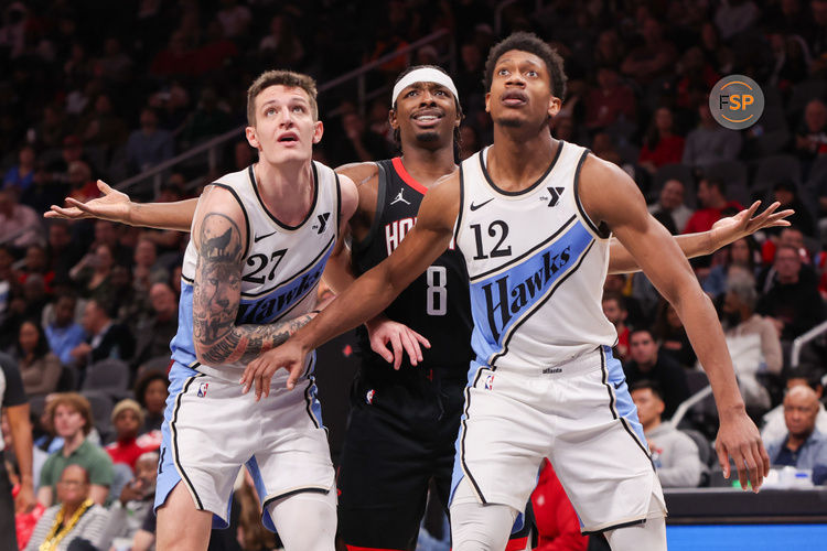 Jan 28, 2025; Atlanta, Georgia, USA; Atlanta Hawks guard Vit Krejci (27) and forward De'Andre Hunter (12) box out Houston Rockets forward Jae'Sean Tate (8) in the third quarter at State Farm Arena. Credit: Brett Davis-Imagn Images
