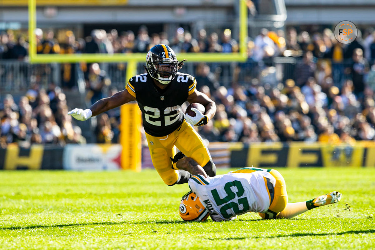 PITTSBURGH, PA - NOVEMBER 12: Pittsburgh Steelers running back Najee Harris (22) is tackled by Green Bay Packers cornerback Keisean Nixon (25) during the regular season NFL football game between the Green Bay Packers and Pittsburgh Steelers on November 12, 2023 at Acrisure Stadium in Pittsburgh, PA. (Photo by Mark Alberti/Icon Sportswire)