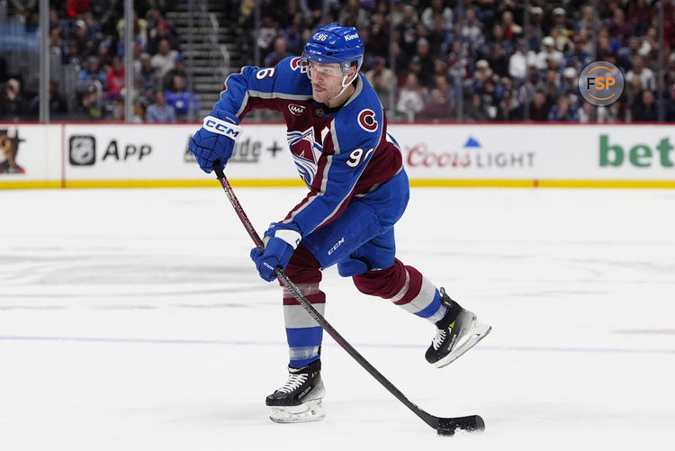 Jan 14, 2025; Denver, Colorado, USA; Colorado Avalanche right wing Mikko Rantanen (96) shoots the puck in the second period against the New York Rangers at Ball Arena. Credit: Ron Chenoy-Imagn Images