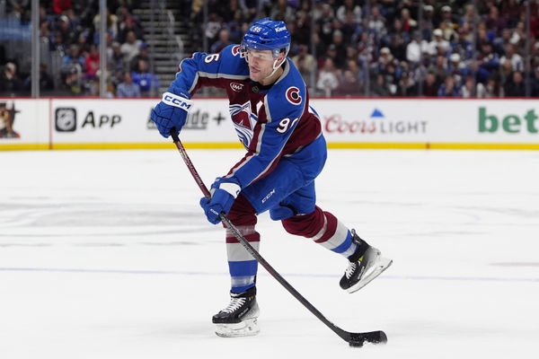 Jan 14, 2025; Denver, Colorado, USA; Colorado Avalanche right wing Mikko Rantanen (96) shoots the puck in the second period against the New York Rangers at Ball Arena. Mandatory Credit: Ron Chenoy-Imagn Images