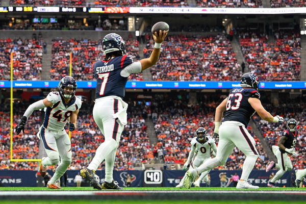 HOUSTON, TX - DECEMBER 03: Houston Texans quarterback C.J. Stroud (7) throws from near his own endzone as Denver Broncos linebacker Alex Singleton (49) applies pressure during the football game between the Denver Broncos and Houston Texans at NRG Stadium on December 3, 2023 in Houston, Texas. (Photo by Ken Murray/Icon Sportswire)