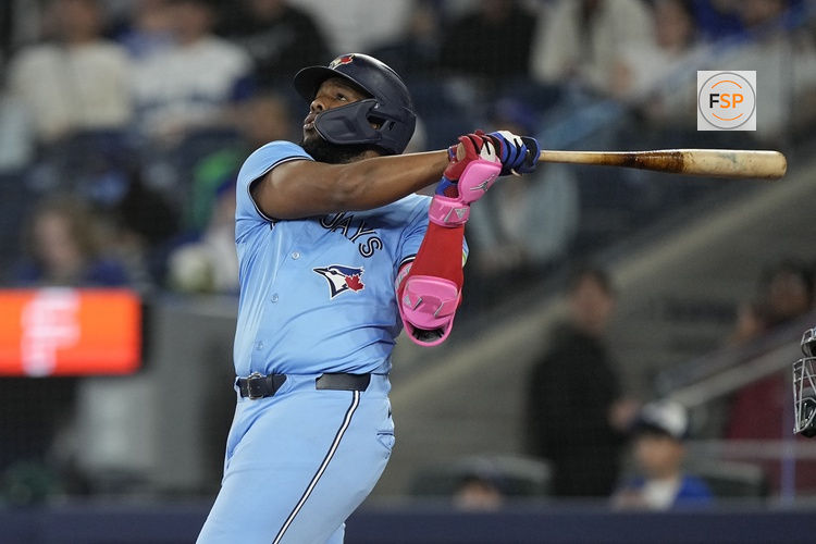 May 29, 2025; Toronto, Ontario, CAN; Toronto Blue Jays first baseman Vladimir Guerrero (27) hits a two run home run against the Athletics during the second inning at Rogers Centre. Credit: John E. Sokolowski-Imagn Images