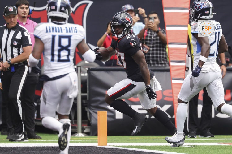 Sep 28, 2025; Houston, Texas, USA; Houston Texans running back Woody Marks (27) runs with the ball and scores a touchdown during the fourth quarter against the Tennessee Titans at NRG Stadium. Credit: Troy Taormina-Imagn Images