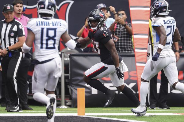 Sep 28, 2025; Houston, Texas, USA; Houston Texans running back Woody Marks (27) runs with the ball and scores a touchdown during the fourth quarter against the Tennessee Titans at NRG Stadium. Mandatory Credit: Troy Taormina-Imagn Images