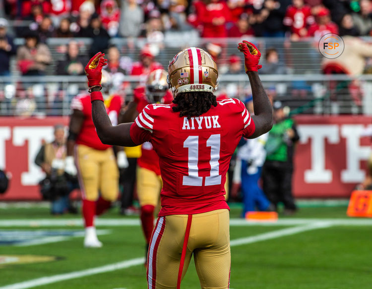 SANTA CLARA, CA - DECEMBER 11: San Francisco 49ers wide receiver Brandon Aiyuk (11) reacts to a touchdown in the first quarter of an NFL game between the San Francisco 49ers and Tampa Bay Buccaneers on December 11, 2022, at Levi’s Stadium, in Santa Clara, CA. (Photo by Tony Ding/Icon Sportswire)