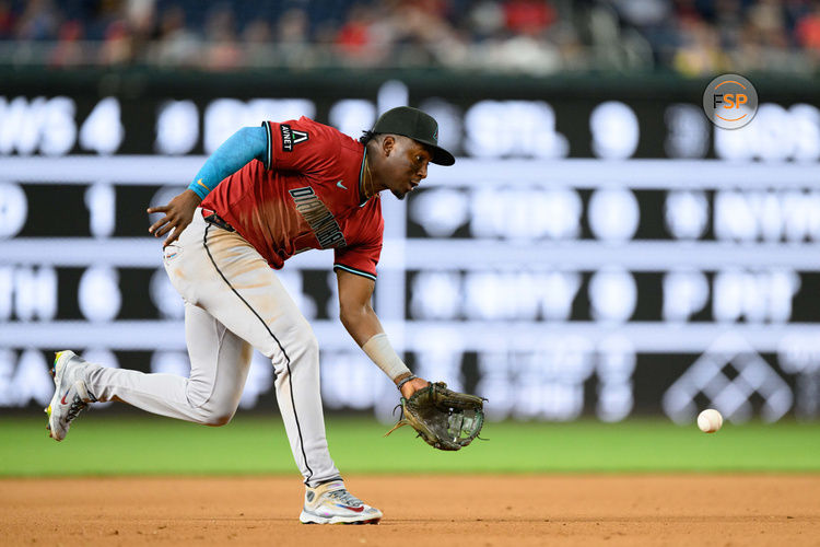 Apr 4, 2025; Washington, District of Columbia, USA; Arizona Diamondbacks shortstop Geraldo Perdomo (2) fields the ball during the sixth inning against the Washington Nationals at Nationals Park. Credit: Reggie Hildred-Imagn Images