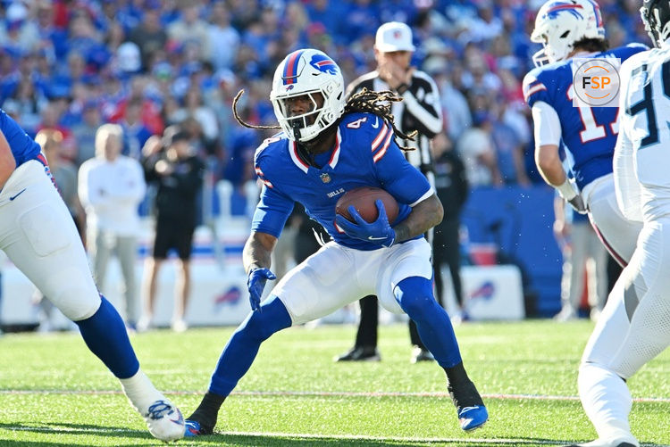 Oct 20, 2024; Orchard Park, New York, USA; Buffalo Bills running back James Cook (4) runs against the Tennessee Titans in the fourth quarter at Highmark Stadium. Credit: Mark Konezny-Imagn Images