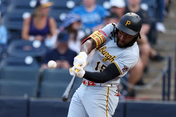 Mar 31, 2025; St. Petersburg, Florida, USA; Pittsburgh Pirates center fielder Oneil Cruz (15) hits a base hit against the Tampa Bay Rays in the first inning at George M. Steinbrenner Field. Mandatory Credit: Nathan Ray Seebeck-Imagn Images