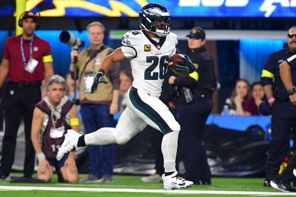 Dec 8, 2025; Inglewood, California, USA; Philadelphia Eagles running back Saquon Barkley (26) runs for a touchdown against the Los Angeles Chargers in the second half at SoFi Stadium. Mandatory Credit: Gary A. Vasquez-Imagn Images