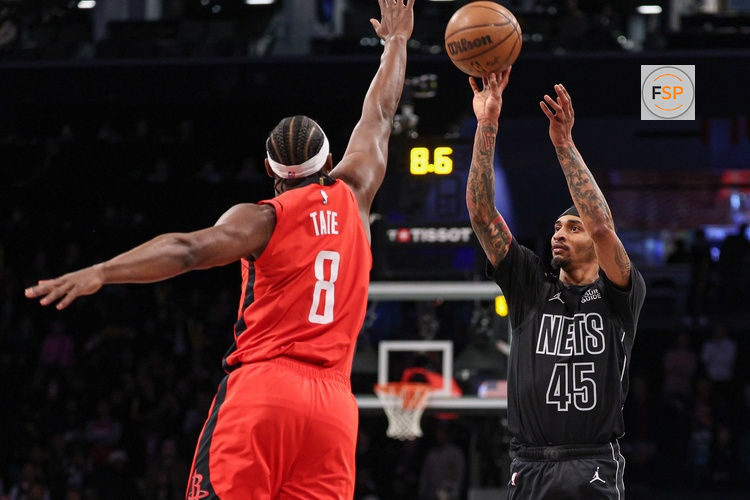 Feb 4, 2025; Brooklyn, New York, USA; Brooklyn Nets guard Keon Johnson (45) shoots the ball as Houston Rockets forward Jae'Sean Tate (8) defends during the second half at Barclays Center. Credit: Vincent Carchietta-Imagn Images