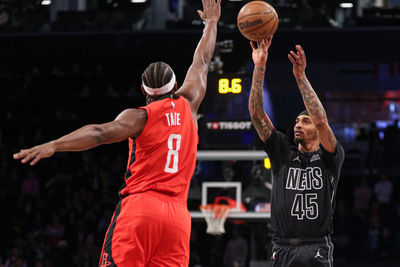 Feb 4, 2025; Brooklyn, New York, USA; Brooklyn Nets guard Keon Johnson (45) shoots the ball as Houston Rockets forward Jae'Sean Tate (8) defends during the second half at Barclays Center. Mandatory Credit: Vincent Carchietta-Imagn Images