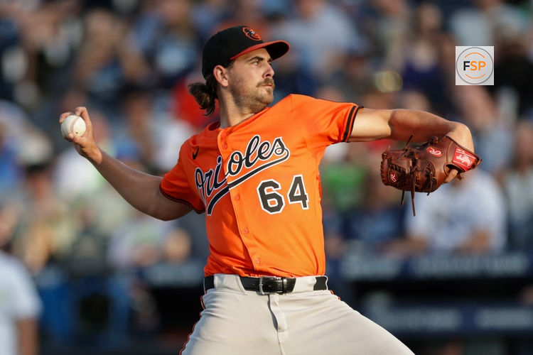 Jul 19, 2025; Tampa, Florida, USA; Baltimore Orioles starting pitcher Dean Kremer (64) throws a pitch against the Tampa Bay Rays in the first inning at George M. Steinbrenner Field. Credit: Nathan Ray Seebeck-Imagn Images
