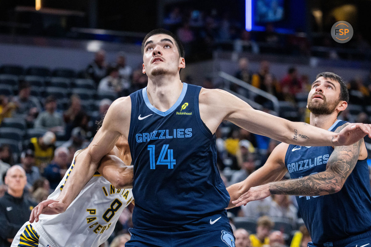 Oct 14, 2024; Indianapolis, Indiana, USA; Memphis Grizzlies center Zach Edey (14) boxes out Indiana Pacers forward Enrique Freeman (8) in the second half at Gainbridge Fieldhouse. Credit: Trevor Ruszkowski-Imagn Images