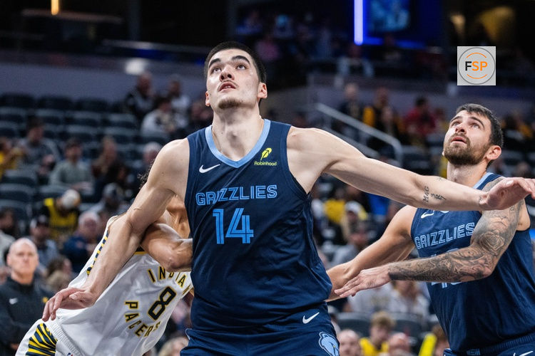 Oct 14, 2024; Indianapolis, Indiana, USA; Memphis Grizzlies center Zach Edey (14) boxes out Indiana Pacers forward Enrique Freeman (8) in the second half at Gainbridge Fieldhouse. Credit: Trevor Ruszkowski-Imagn Images