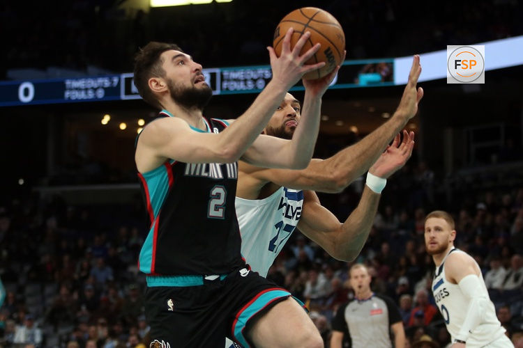 Jan 31, 2026; Memphis, Tennessee, USA; Memphis Grizzlies guard Ty Jerome (2) drives to the basket as Minnesota Timberwolves center Rudy Gobert (27) defends during the first quarter at FedExForum. Credit: Petre Thomas-Imagn Images