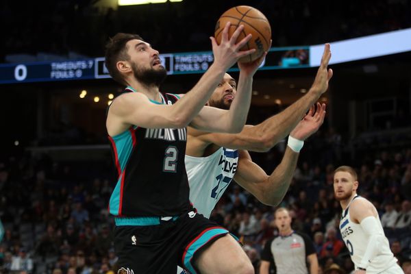Jan 31, 2026; Memphis, Tennessee, USA; Memphis Grizzlies guard Ty Jerome (2) drives to the basket as Minnesota Timberwolves center Rudy Gobert (27) defends during the first quarter at FedExForum. Mandatory Credit: Petre Thomas-Imagn Images