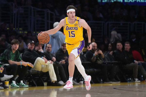 Jan 23, 2025; Los Angeles, California, USA; Los Angeles Lakers guard Austin Reaves (15) dribbles the ball against the Boston Celtics at the Crypto.com Arena. Mandatory Credit: Kirby Lee-Imagn Images